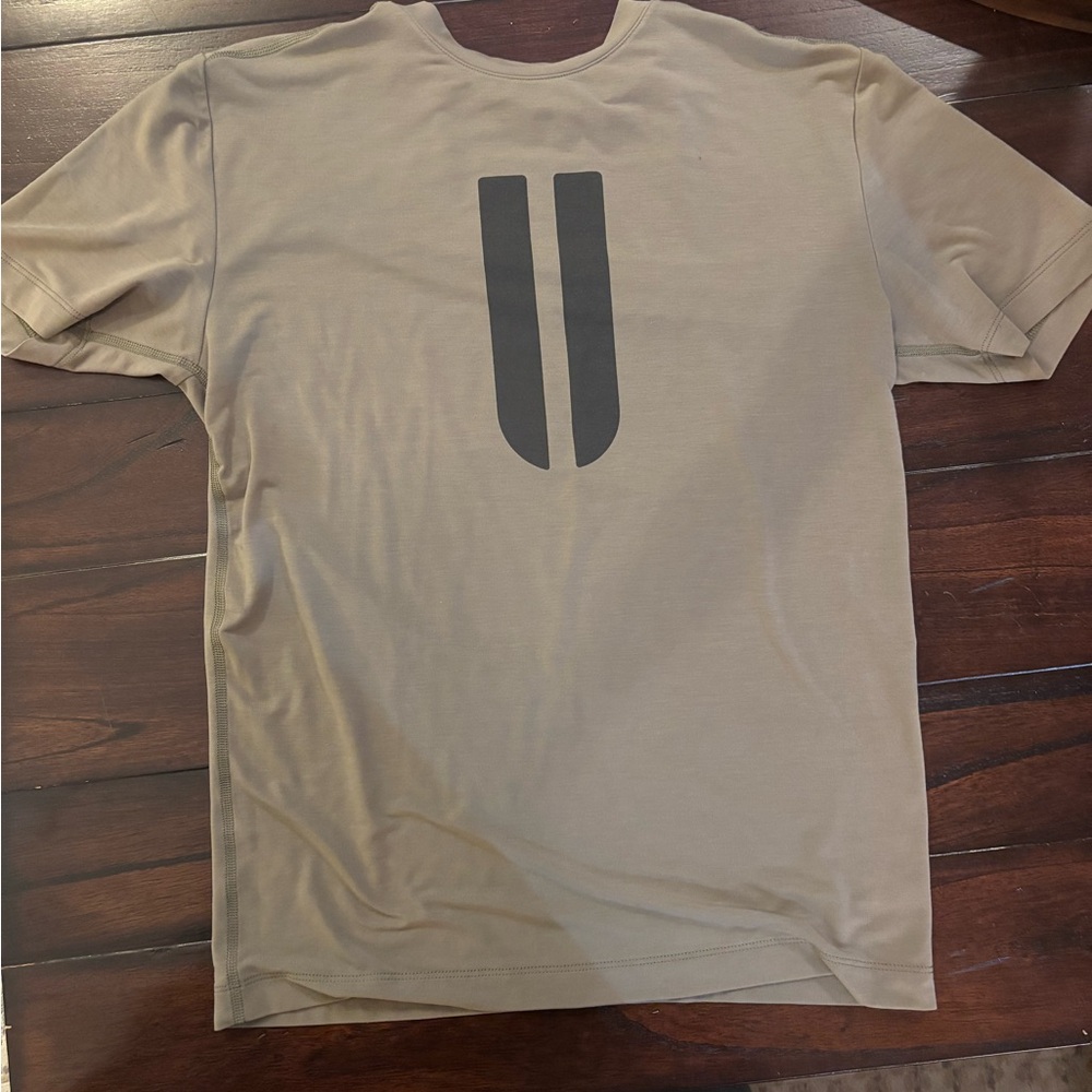 NOBULL Men's Beige T-Shirt with Black Graphic